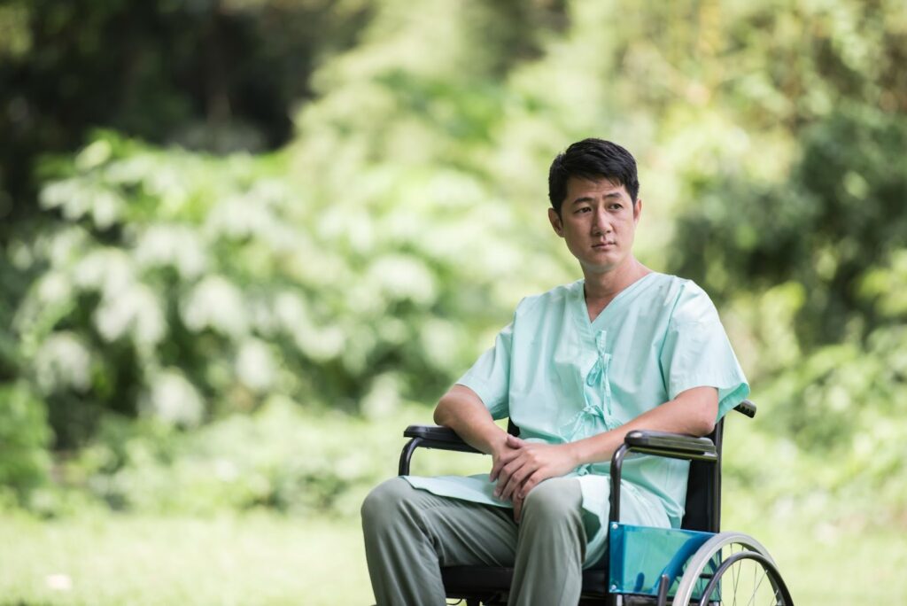 imobilised man sitting on a wheelchair