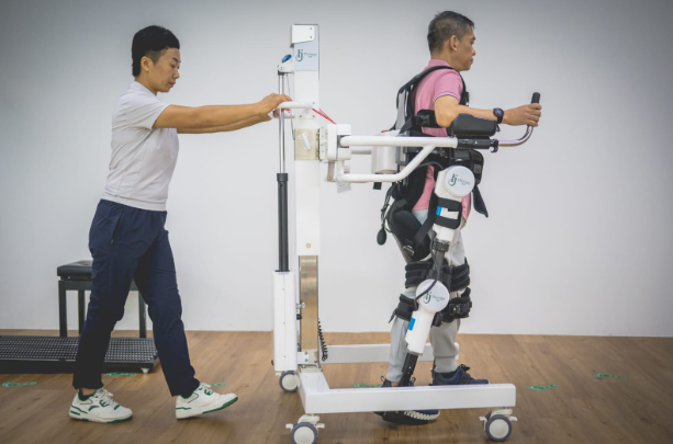 man using walking assistant machine